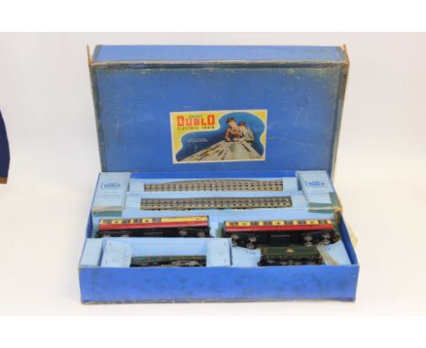 A Hornby Dublo Electric Train, Made in England by Meccano limited, comprising silver king model engine and tender, two coache