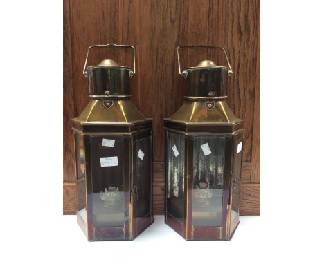 A pair of brass carriage hand held oil lamps, original ceramic burners in place