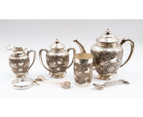 A collection of Chinese silver/white metal including a four piece tea set comprising of; tea pot and strainer, milk jug, suga