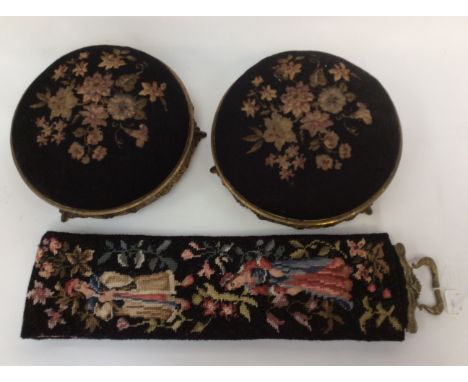 A pair of footstools, early 19th Century gilt metal and pinewood with tapestry floral covers; together with a later tapestry 