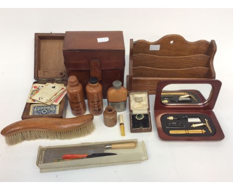 A collectors lot including sharing set; letter rack; inlaid box of cards leather box; paste set brooch; small hip flask (1 bo