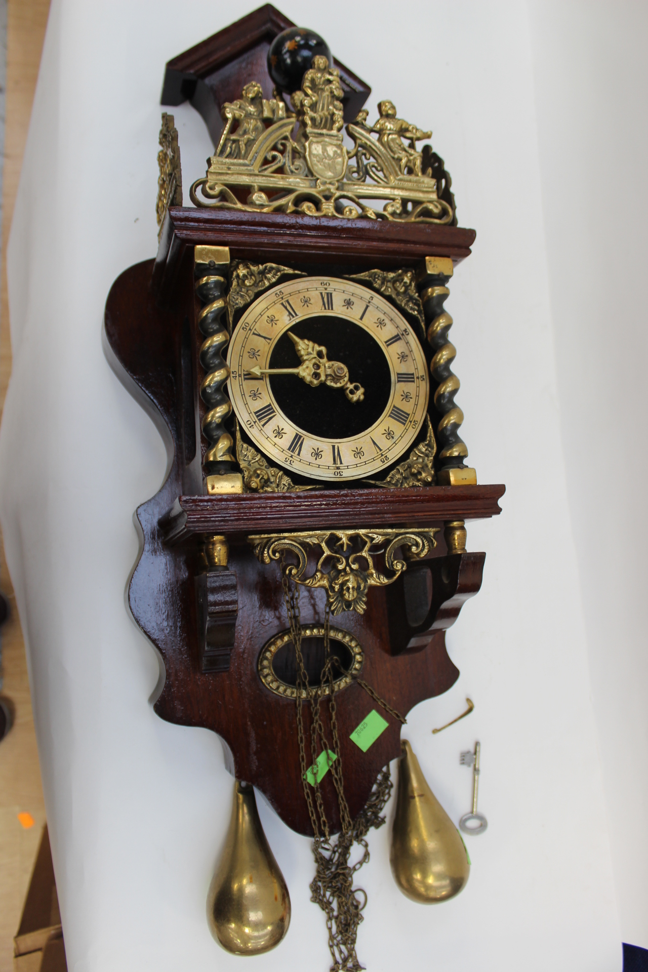 A 20th Century brass faced wall clock, with weights, together with