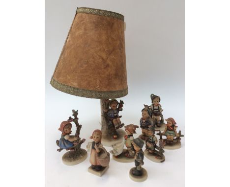 A collection of 70's Hummel figures with lamp