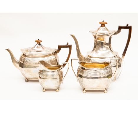 A Victorian matched silver four piece tea and coffee service, gadroon rims each fluted body with ribbed section and four anth