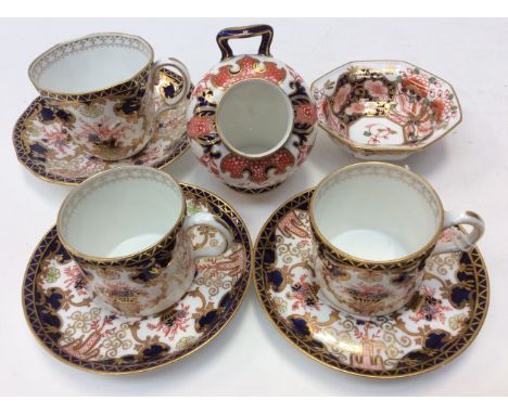 Two Royal Crown Derby 3788 pattern coffee cans and saucers, one matching tea cup and saucer, reference 2412 miniature salt pi