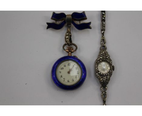 A silver and blue enamel nurses fob watch, manual movement, having circular white enamel Arabic numeral dial with yellow meta