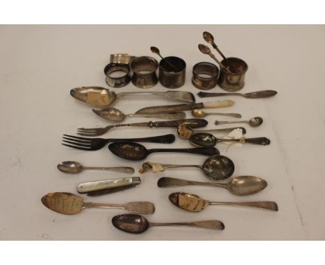 Napkin rings, sugar tongs, pen knife (mother of pearl casing) odd Georgian spoons, pickle fork, etc, gross 550 gms, 17.68 tro