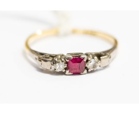 An 18ct Gold, Ruby and Diamond ring, set with a central square cut ruby, with diamonds set to the shoulders, size P, total gr