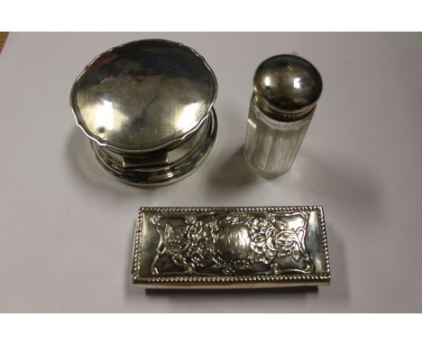 Three items of silver comprising of a; trinket box, a small pocket box and a silver topped glass bottle (3)