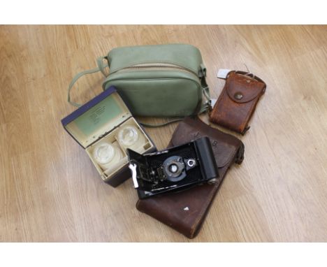 A Kodak vest pocket camera with tan leather case dated 1916, 1930s Houghtons box camera and leather case, Kodak No 2 brownie 