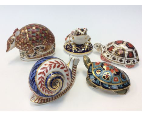 Five Royal Crown Derby paperweights including: Terrapin 2000, gold stopper, boxed; Turtle 1983, ceramic stopper, boxed; Snail