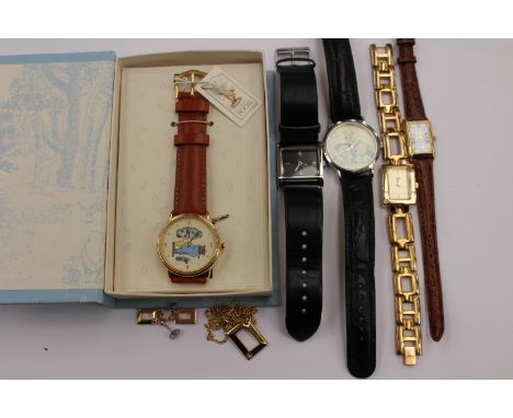A group of  five assorted watches to include a boxed Timex Winnie The Pooh watch