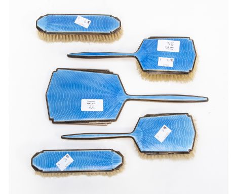 A Walker and Hall Art Deco five piece dressing table set with blue enamel over engine turned engraving