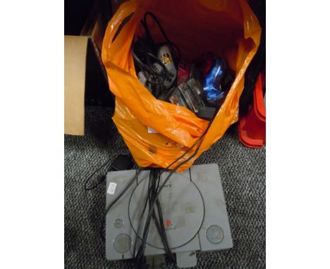 A selection of grey Playstation games and console