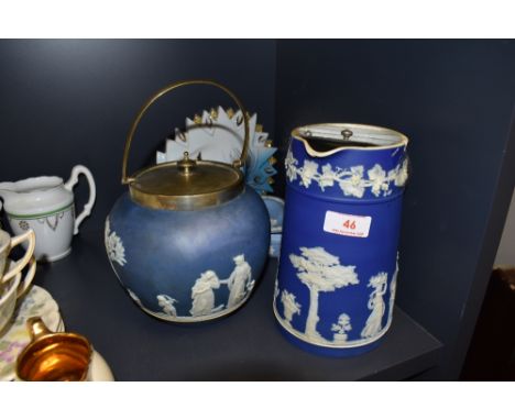 A Wedgwood biscuit barrel and a lidded jug, also included is a small trinket dish.