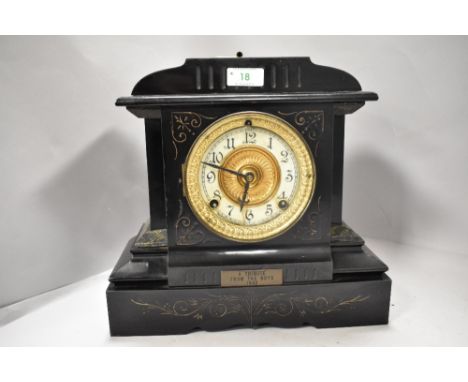 A late Victorian cold painted mantel clock having enamel face with bevelled glass door.