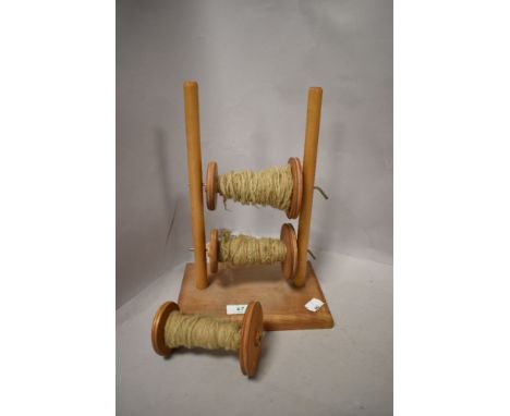 A vintage wooden wool winder.