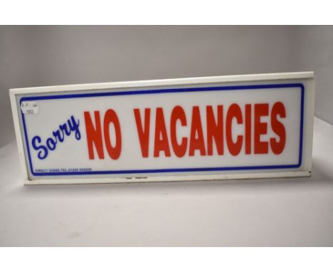 A vintage 'No vacancies' light box.