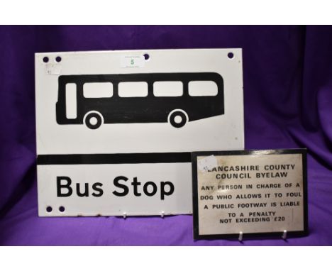 A double sided enamel bus stop sign and a smaller metal plaque for Lancashire County Council Byelaw.
