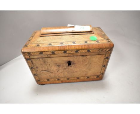 A 19th century walnut veneered tea caddy having parquetry inlaid edging to lid and front and two internal compartments, escut