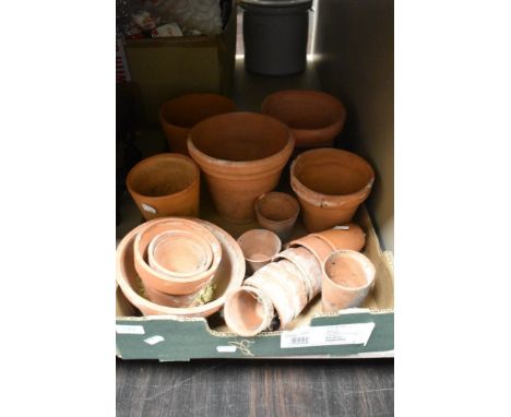 A selection of vintage terracotta plant pots in various sizes and designs