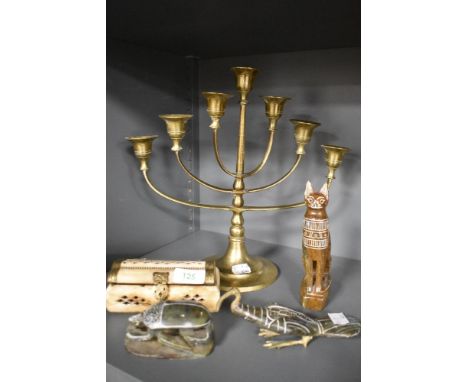 20th century tourist keepsakes including Egyptian stone carved figures and brass Minorah candle stick