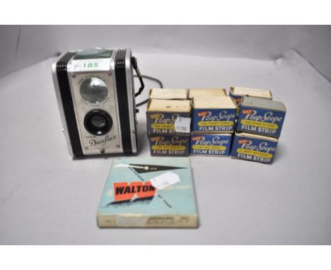 A vintage Kodak Duaflex camera and selection of film, mainly being Kay Peep scope