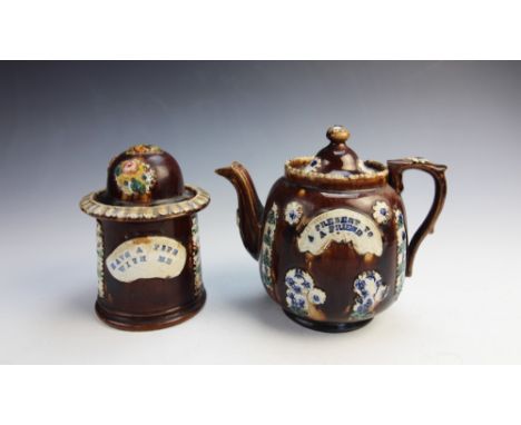 A Victorian bargeware treacle glazed tobacco jar and cover, late 19th century, the body with applied relief moulded floral mo