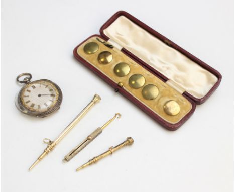 A yellow metal retractable pencil, 8cm long, together with another example, 5.2cm long, a retractable button hook 6.5cm long,