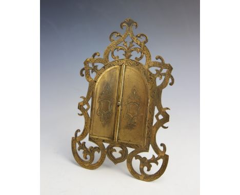 A Victorian gilt metal frame by 'Fisher, 1888 Strand', designed as a pair of central doors opening to reveal a glazed, dome t