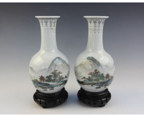 A pair of Chinese vases in the Republic period manner, Jingdezhen, each of bottle form and decorated in a famille verte palet