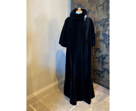 A black velvet cape, the floor length cape with single covered button fastening and large lapel collar, with internal label f