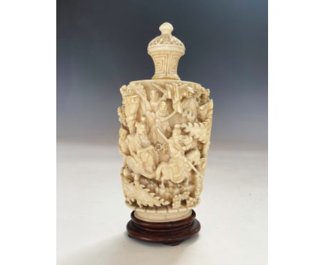 A 19th century Chinese ivory canton snuff box, carved in high relief, depicting an extensive continuing scene of figures and 