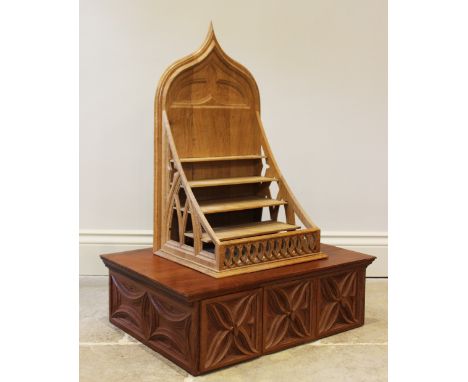 A carved oak free standing spice rack with ogee back and four-tiered stand, 60cm H x 34cm W x 28cm D, with a carved three dra