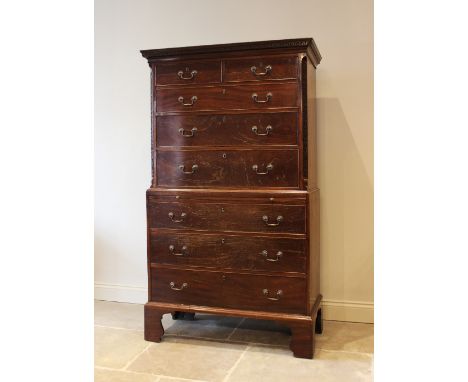 A 19th century Chippendale style mahogany chest on chest, the upper chest with a Greek key pattern frieze above two short and