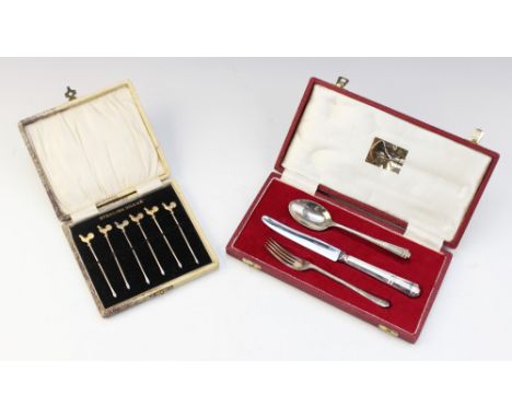 A cased set of six silver sandwich skewers, each surmounted with a realistically modelled gilt cockerel, each blade stamped '