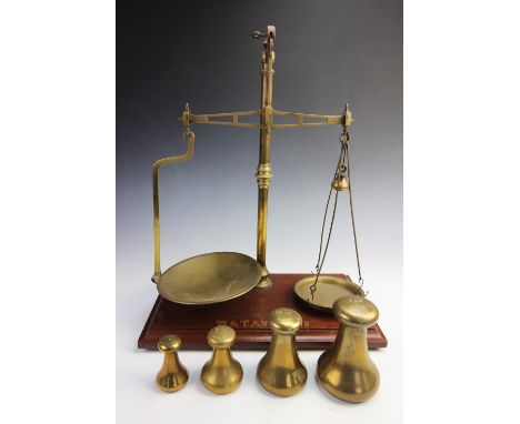 A W.&amp;T. Avery Ltd balance scale, the brass balance of typical form, mounted on a wooden base with transfer printed maker'