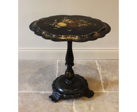 A Victorian papier mache pedestal occasional table, the oval tilt top with a scalloped rim, centred with a painted floral spr