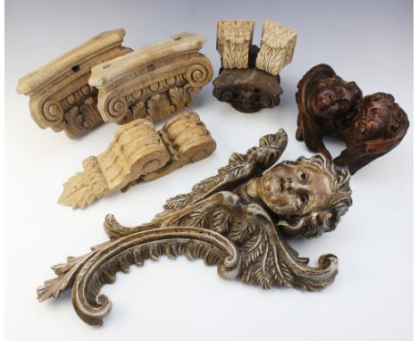 A collection of carved architectural wooden items, 20th century, comprising a carved column capital, 11cm H, a pair of painte