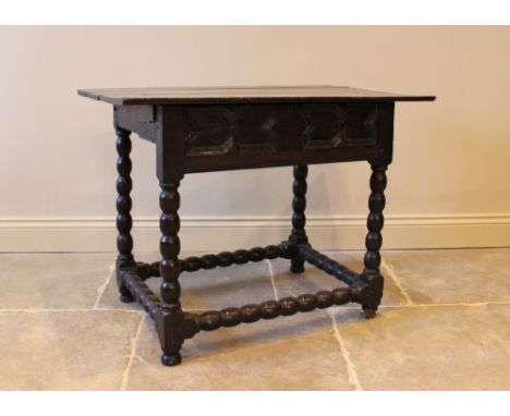 A 17th century and later, oak plank top side table, circa 1650, the triple plank top above a single geometrically moulded fri