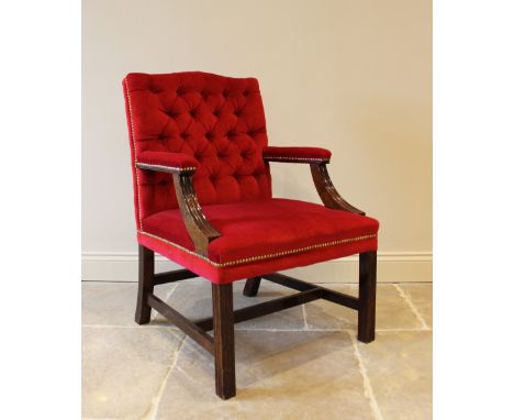 A Gainsborough type button back armchair, the mahogany frame upholstered in a crimson velvet and raised on chanelled legs of 