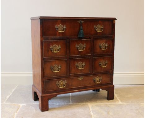 A George III style mahogany secretaire chest, the rectangular cross banded and quarter veneered top above a fall front top dr