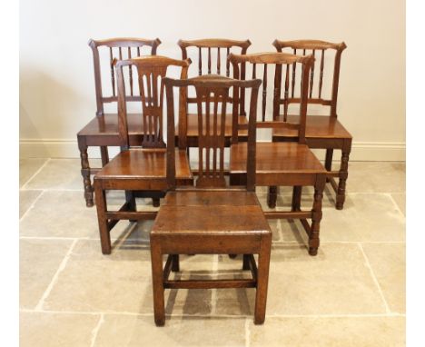 A matched set of six oak country chairs, comprising a pair of 18th century oak chairs with pierced splat back and board seat,