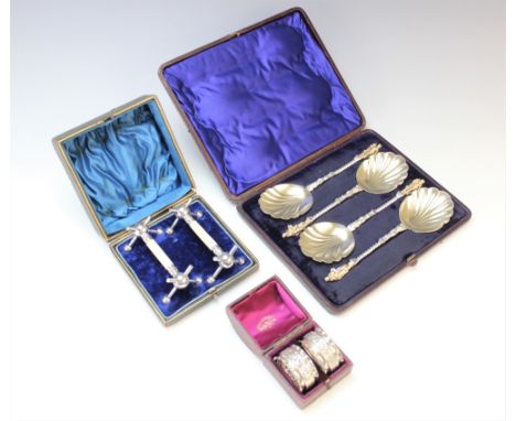 A cased set of four Victorian Apostle type spoons Martin Hall and Co, each with figural terminal, twisted stem and shell shap