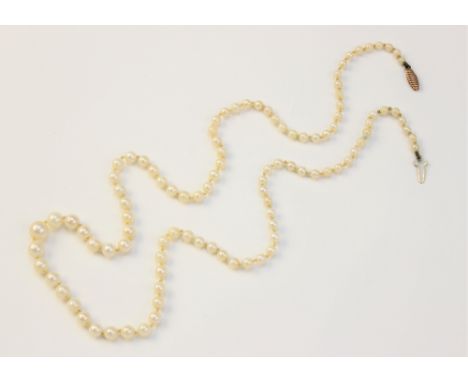 A single strand cultured pearl necklace, of graduated form and with yellow metal clasp stamped '375', 56cm long overall 