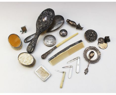 A selection of silver and white metal wares, to include; a Continental silver compact of circular form with embossed floral d