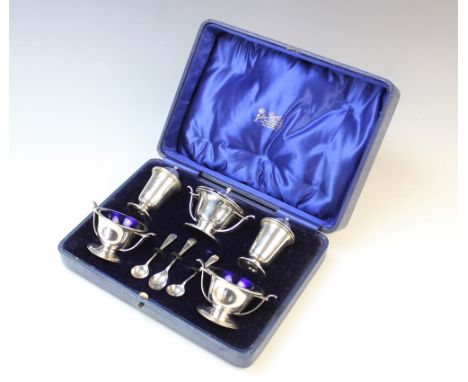 A boxed silver condiment set by Deakin &amp; Francis, Birmingham 1938, comprising wet mustard, two open salts, two pepperette