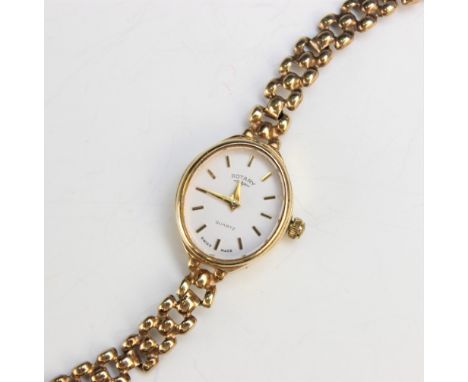 A Lady's 9ct gold Rotary wristwatch, the white oval dial with baton markers, set to a plain polished 9ct gold case, 18mm x 16