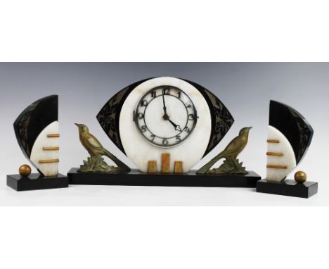 An Art Deco polished slate and white marble clock garniture, early 20th century, the clock with Arabic numerals set to a nave