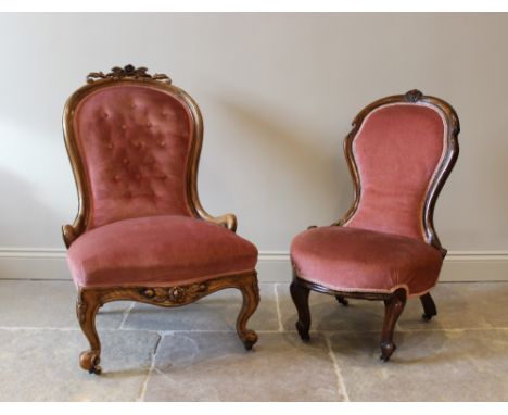 A Victorian mahogany framed balloon back nursing chair, with a foliate carved crest above a pink velour button back and a spr